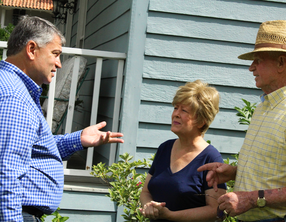 Ivan Figueroa speaking with couple